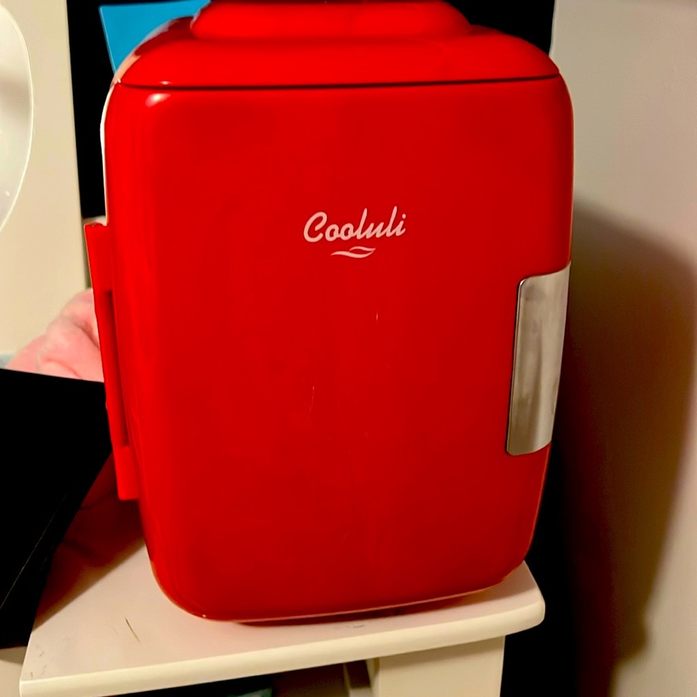 Red mini fridge with a bunch of compartments